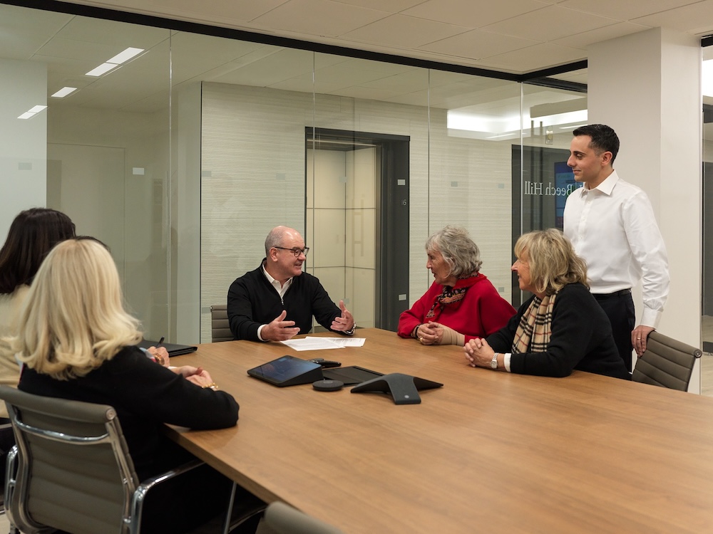 Point Winward advisors at a meeting